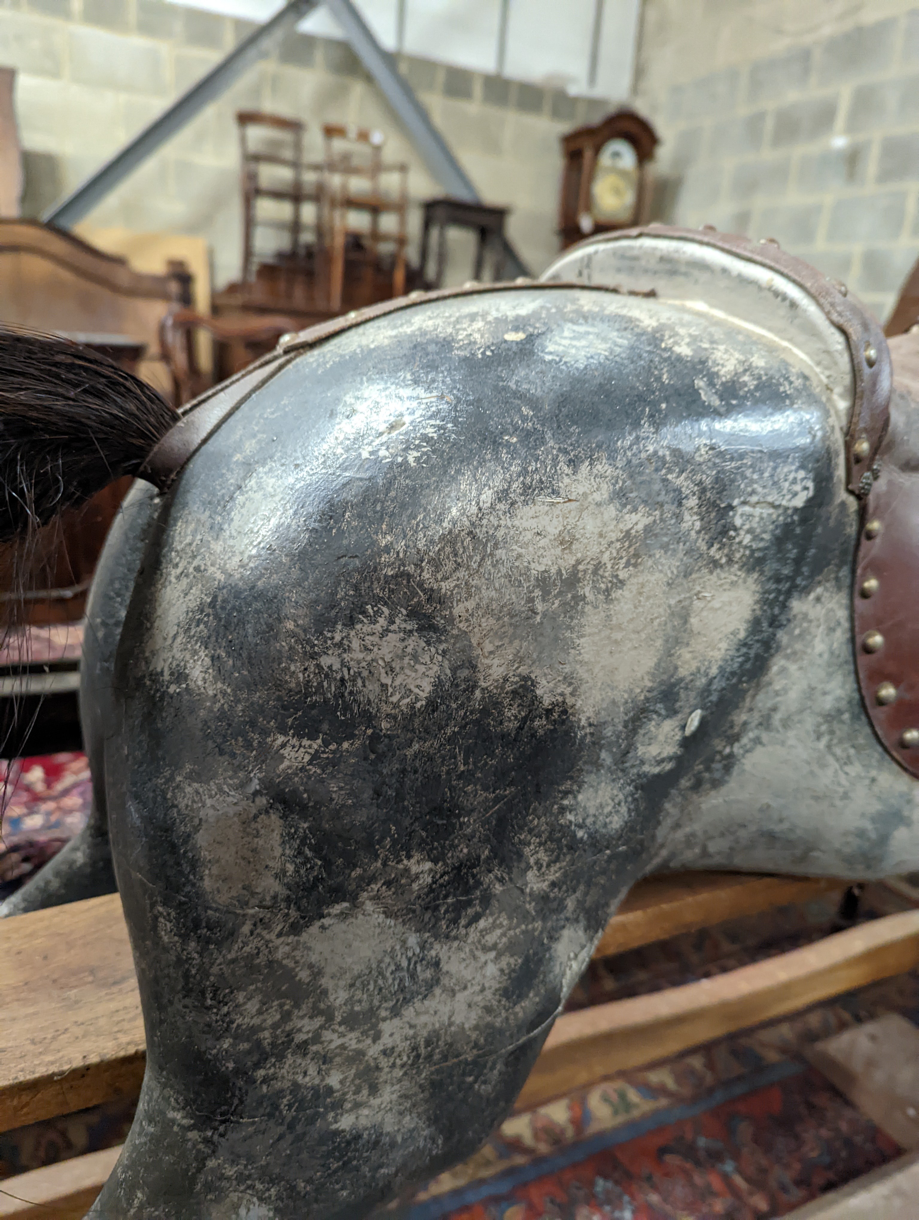 A large Edwardian Ayres type rocking horse on a turned safety frame, length 160cm, height 110cm